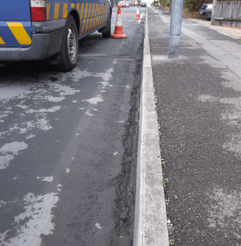 road fretted along kerb edge