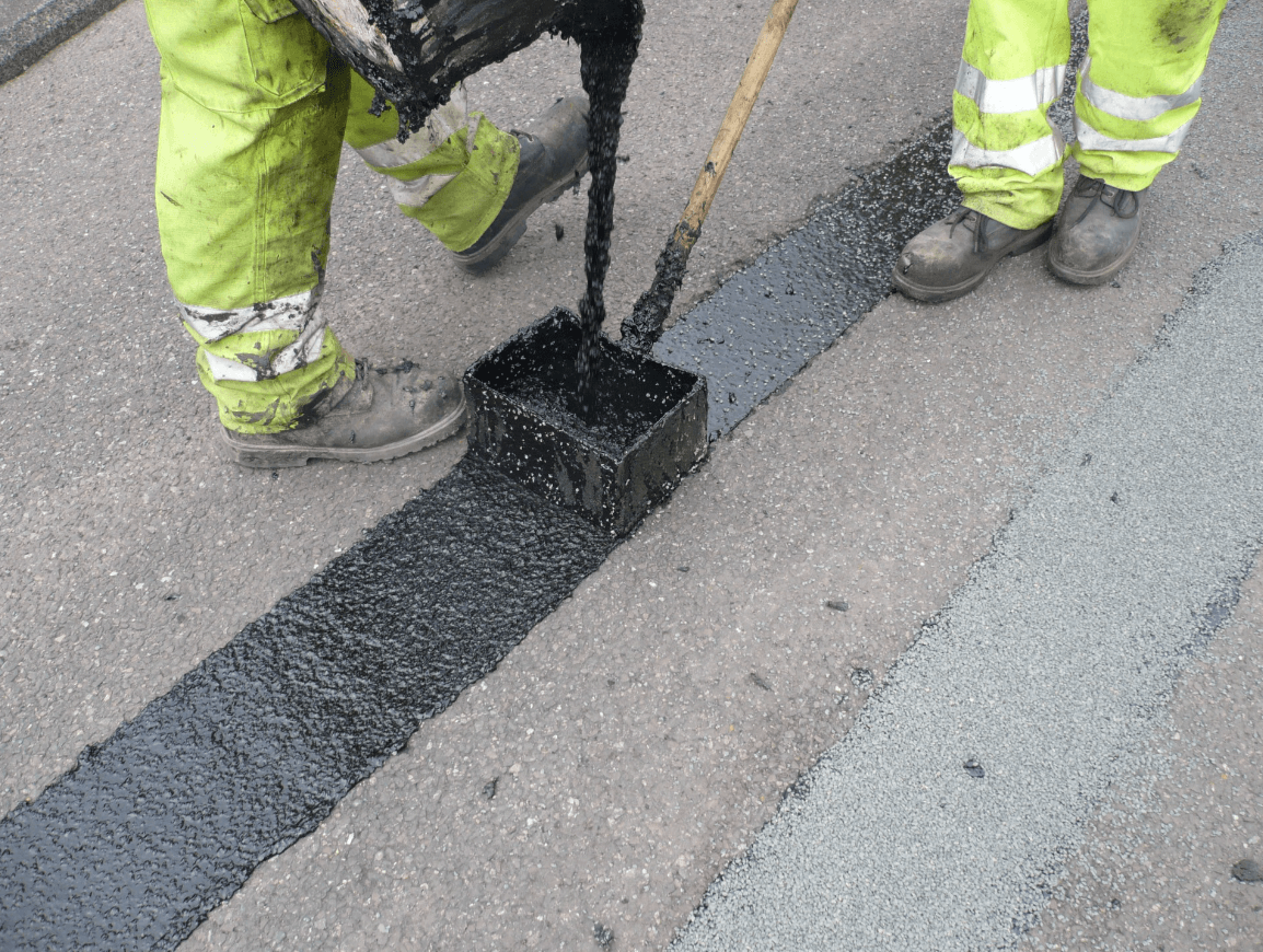 scredding Road crack and joints repaired with Jointmaster BBA HAPAS approved system from Rhino Asphalt Solutions