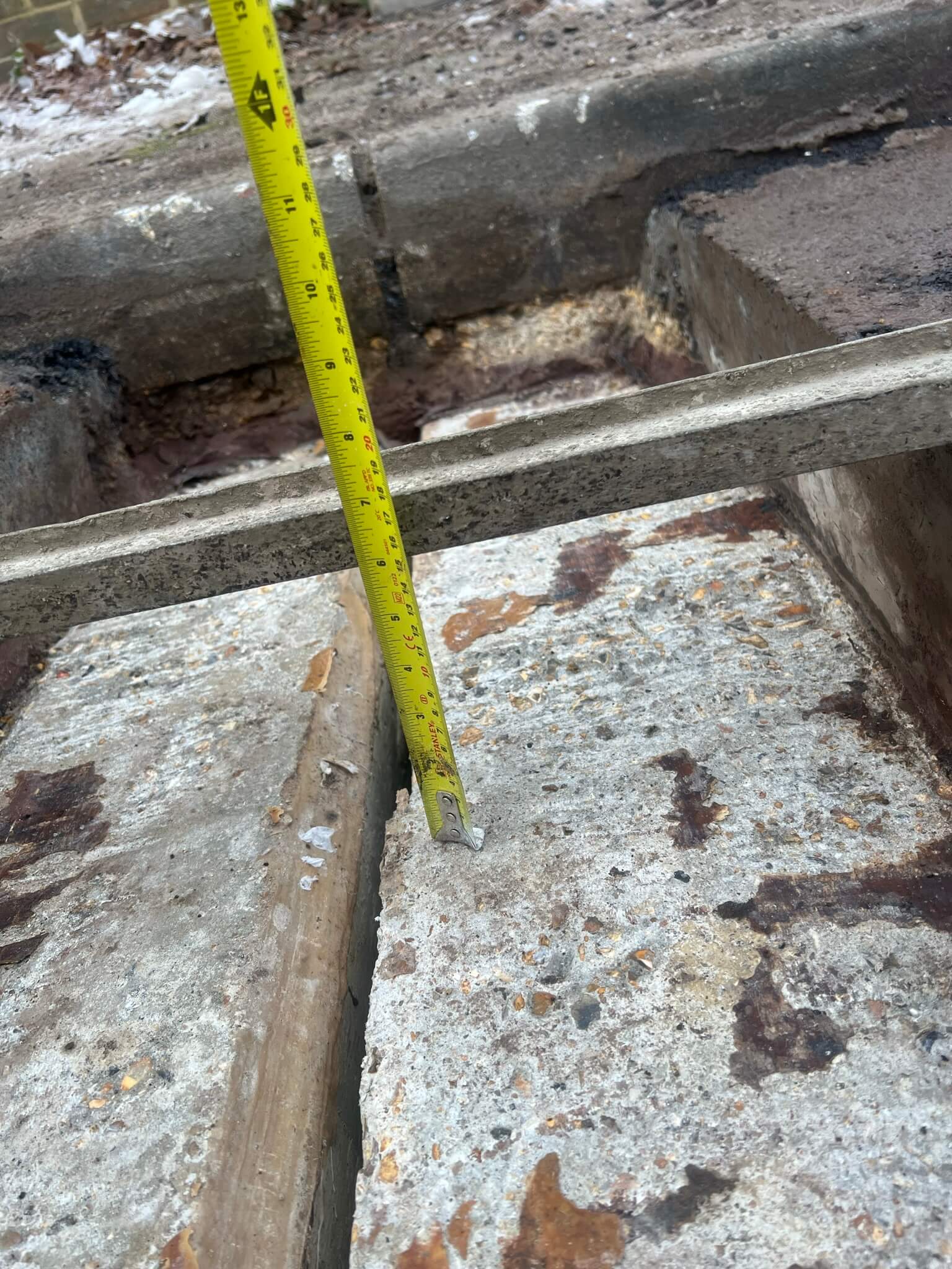 Measuring the depth of joint measuring depth Asphaltic plug bridge joint APJ by Rhino Asphalt