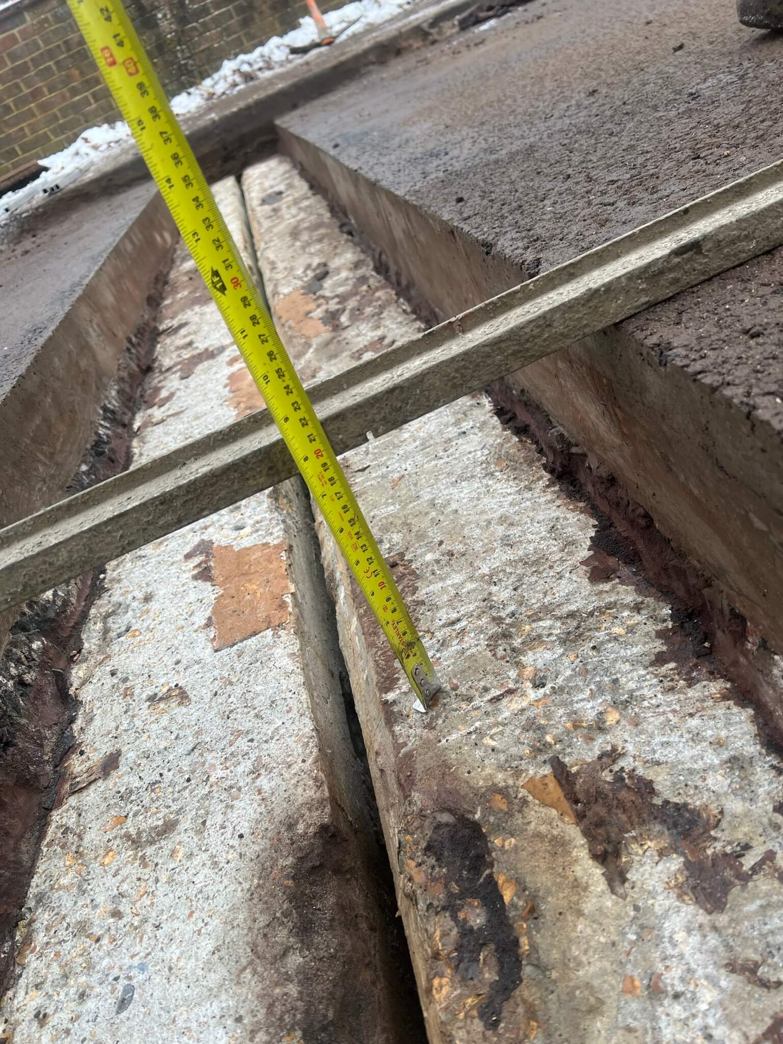 Measuring the depth of joint Asphaltic plug bridge joint APJ by Rhino Asphalt