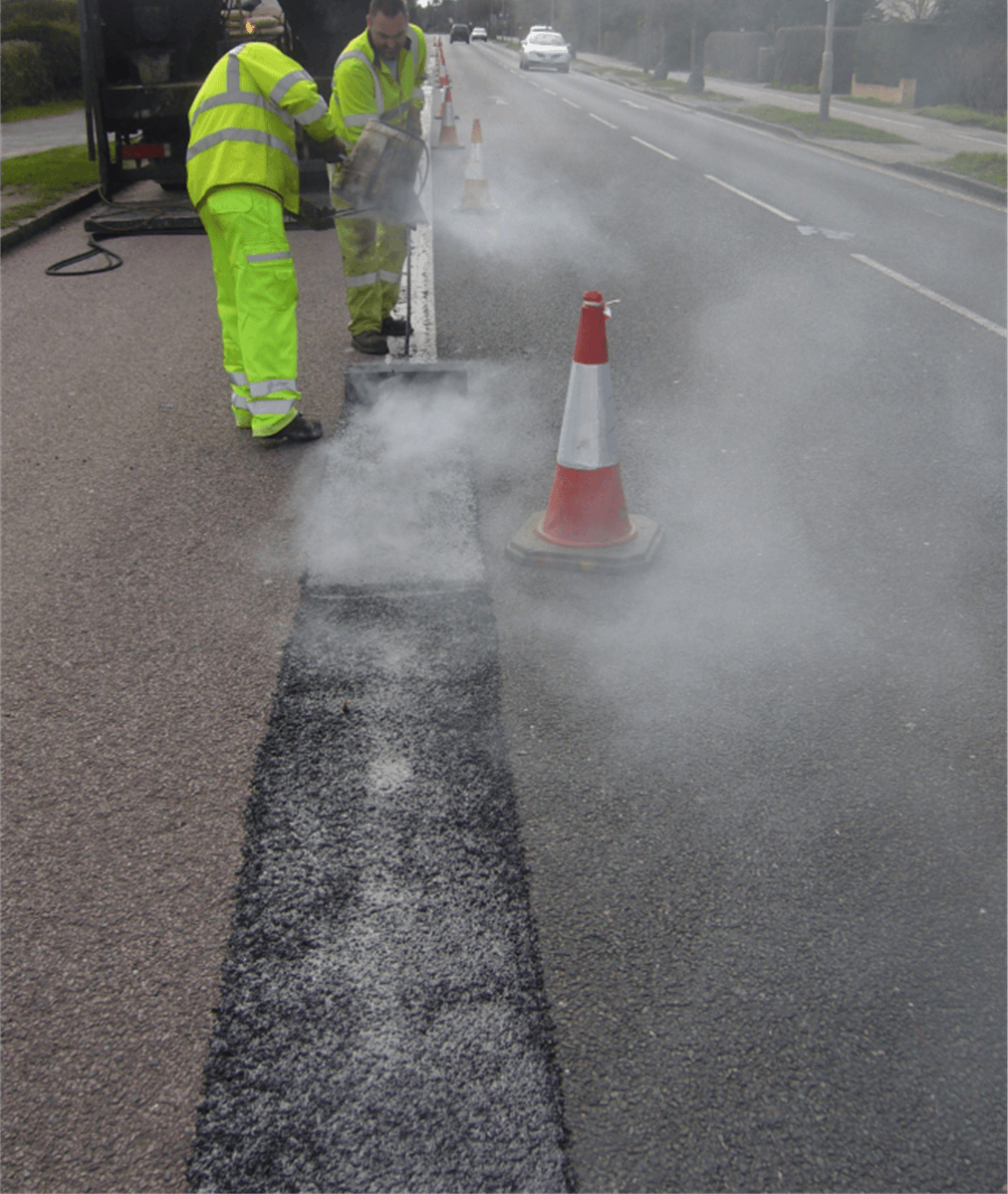 applying BBA HAPAS approved Masterscreed hot screed road repair system from Rhino Asphalt Solutions with BBA HAPAS approval 